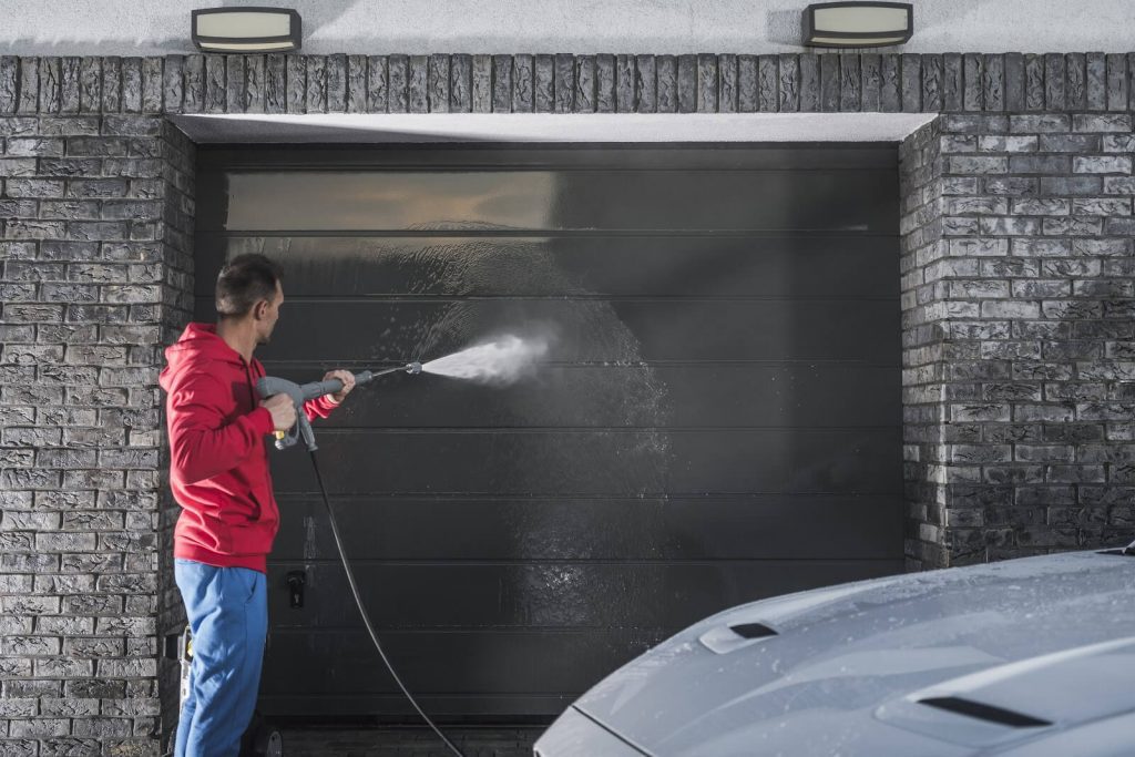 Man-Pressure-Washing-Garage-Door