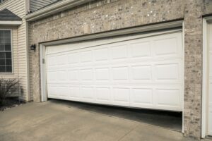 Broken Two Car Garage Door in Residential Home