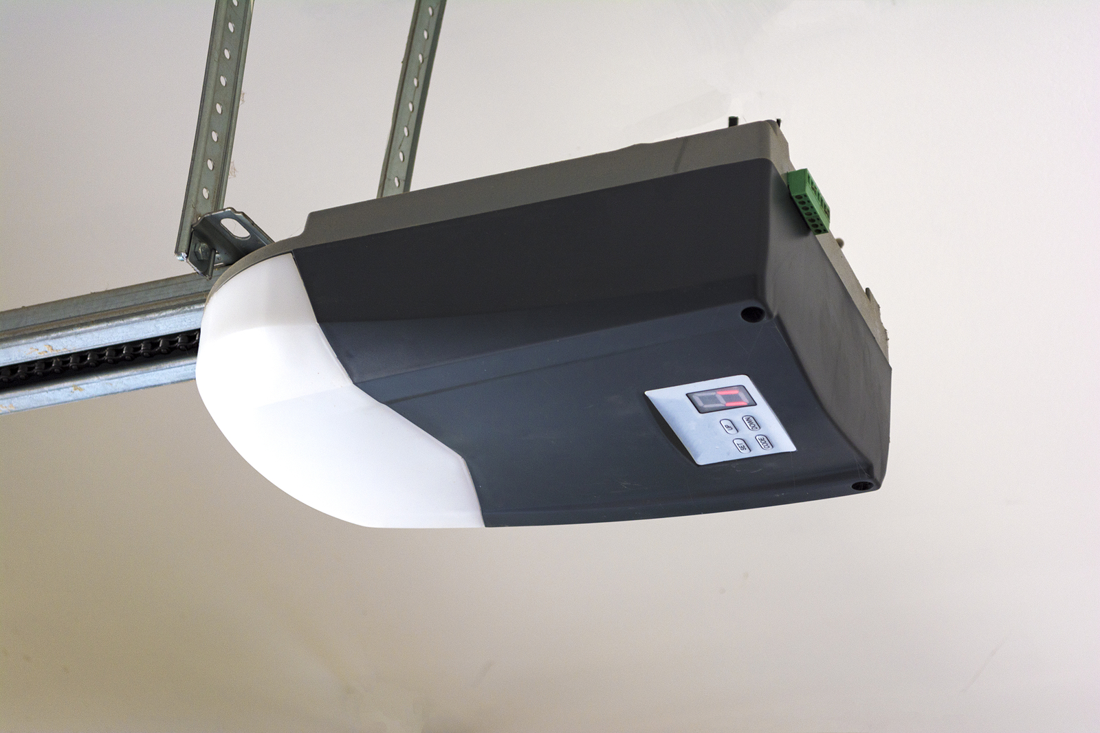 Close-Up-Of-An-Automatic-Garage-Door-Opener-on-Ceiling