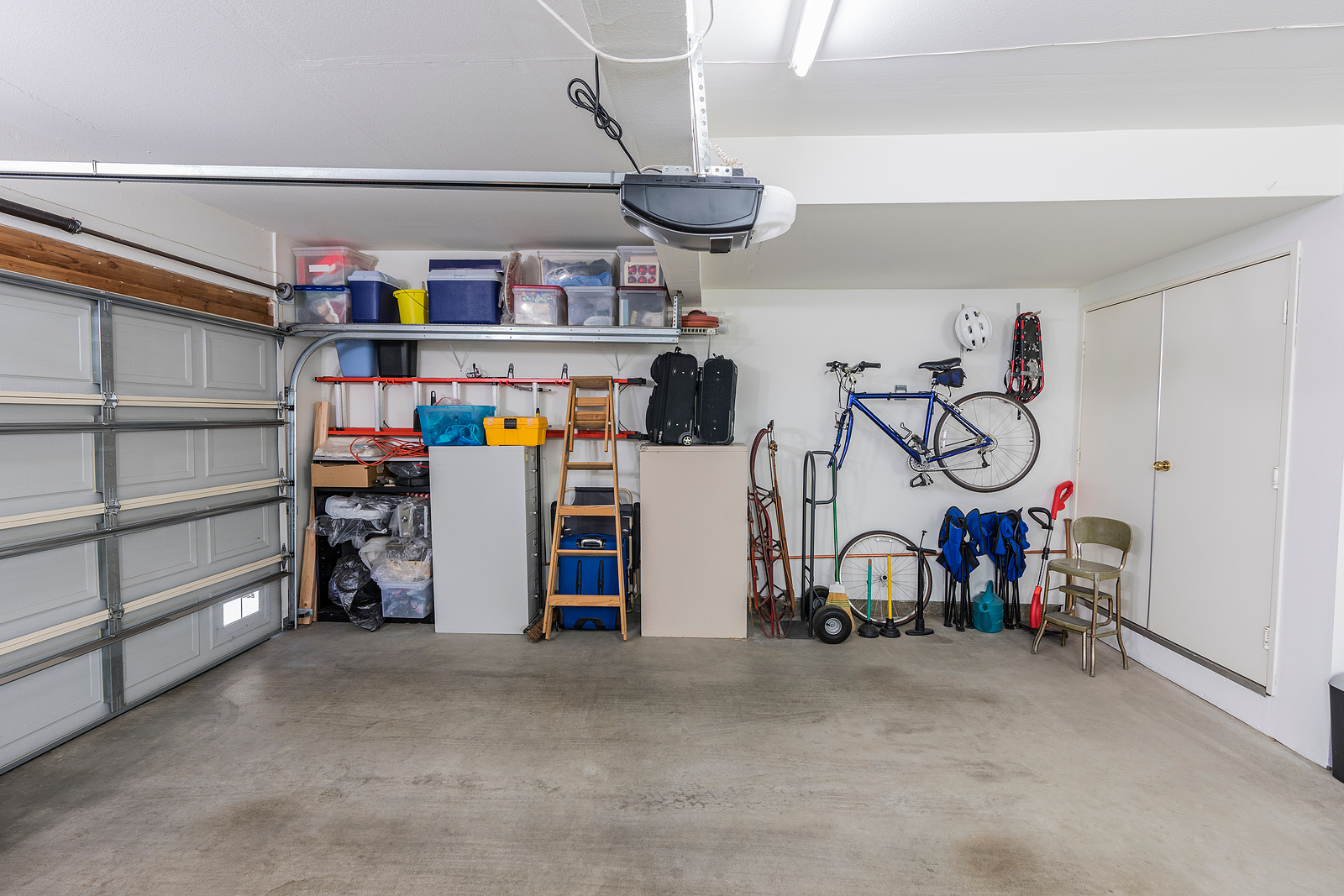 Organized-Residential-Two-Car-Garage-with-Tools-File-Cabinets-and-Sports-Equipment