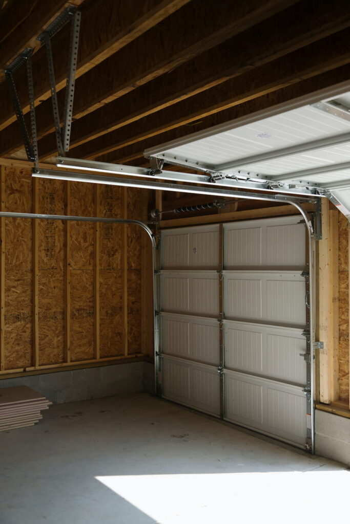 Compare torsion spring vs extension spring systems to learn how garage door springs work, their differences, benefits, safety, and maintenance needs.